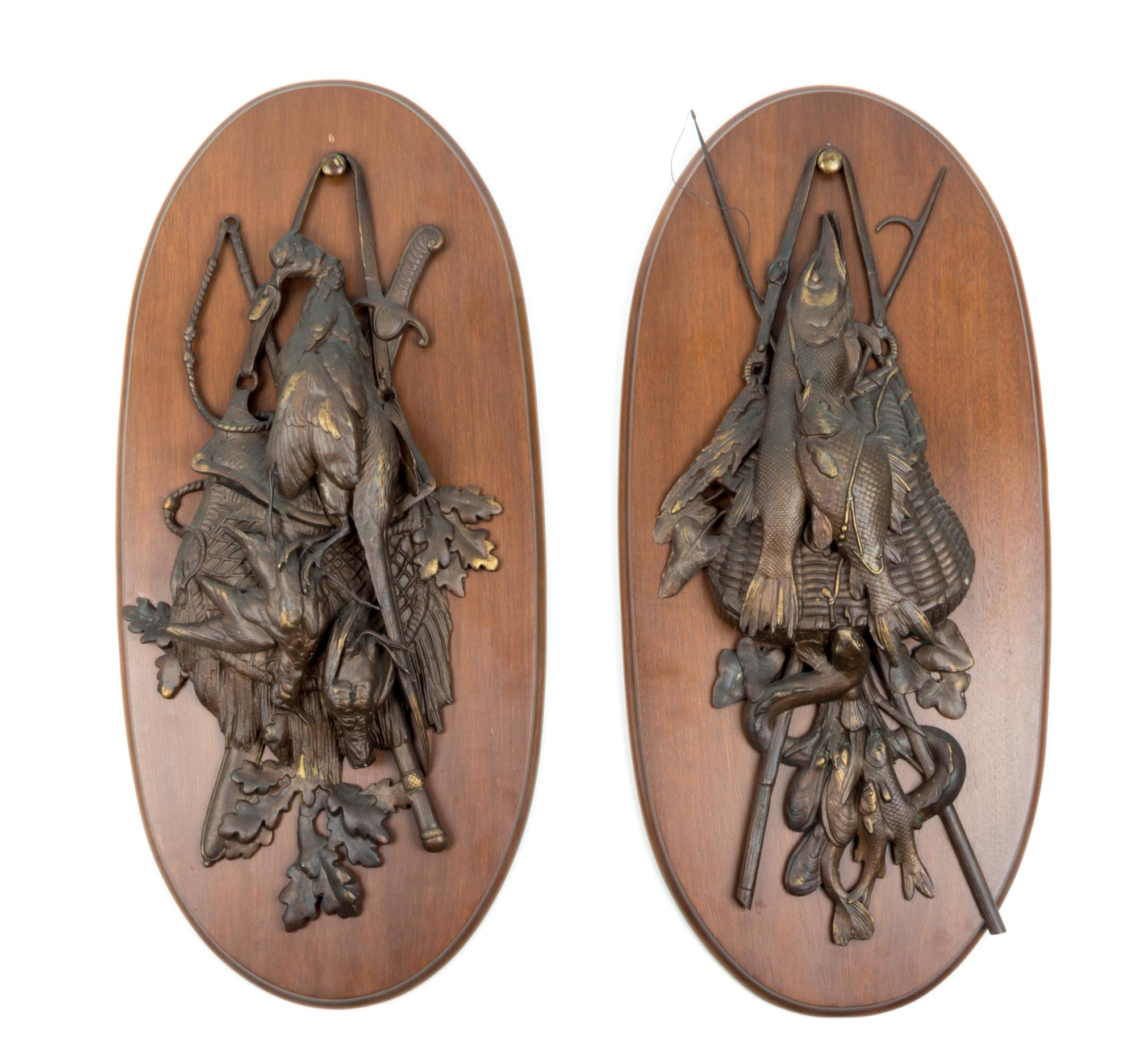 A Pair of Cast Metal Wall Plaques Height 30 inches.
