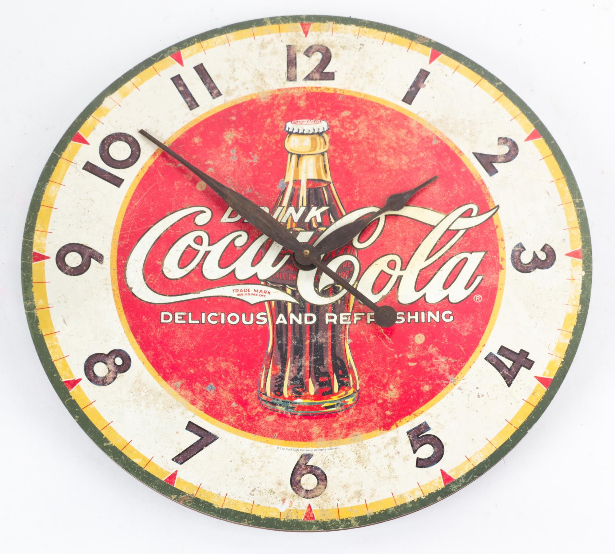 A Reproduction Coca-Cola Wall Clock Diameter 22 1/4 inches.