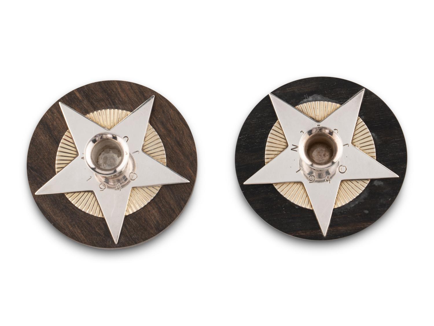 An Associated Pair of Arno Malinowski for Georg Jensen Silver and Ebony Christmas Candle Holders