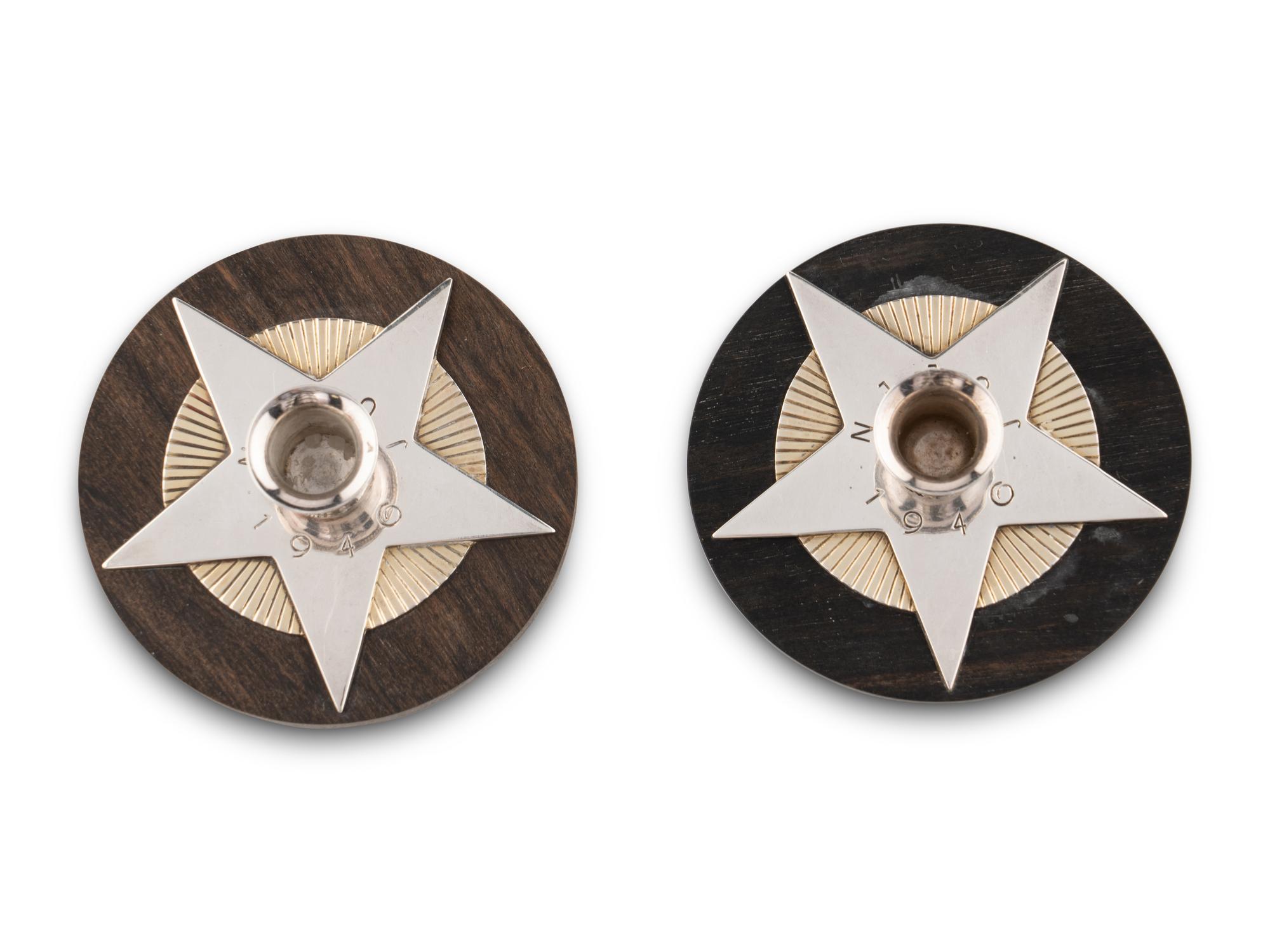 An Associated Pair of Arno Malinowski for Georg Jensen Silver and Ebony Christmas Candle Holders