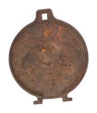A Pair of Cast Iron Kettle Toppers and Two Trivets