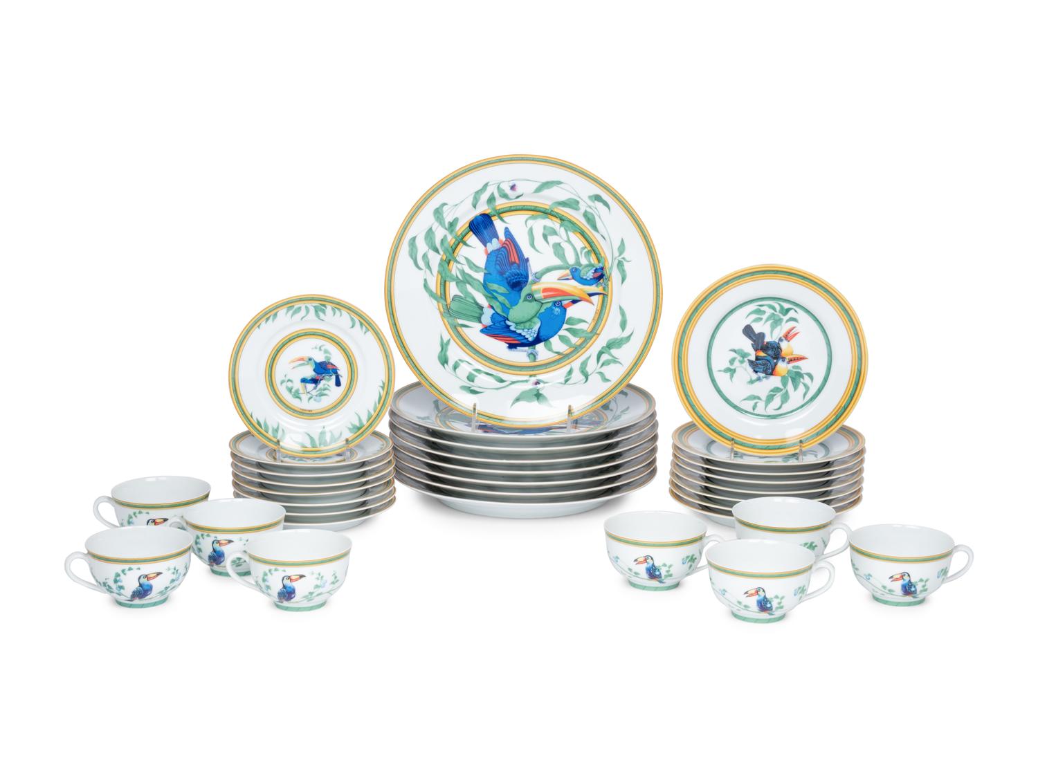An Hermès Porcelain Toucans Porcelain Dinner Service