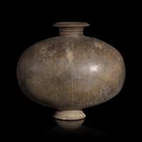 A Chinese Grey Pottery Cocoon Jar, Han Dynasty — 漢 灰陶繭形罐