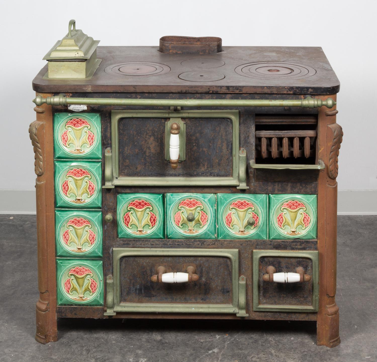 A French Iron Stove Height 31 x width 35 1/2 x depth 24 1/4 inches.