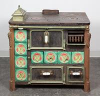 A French Iron Stove Height 31 x width 35 1/2 x depth 24 1/4 inches.