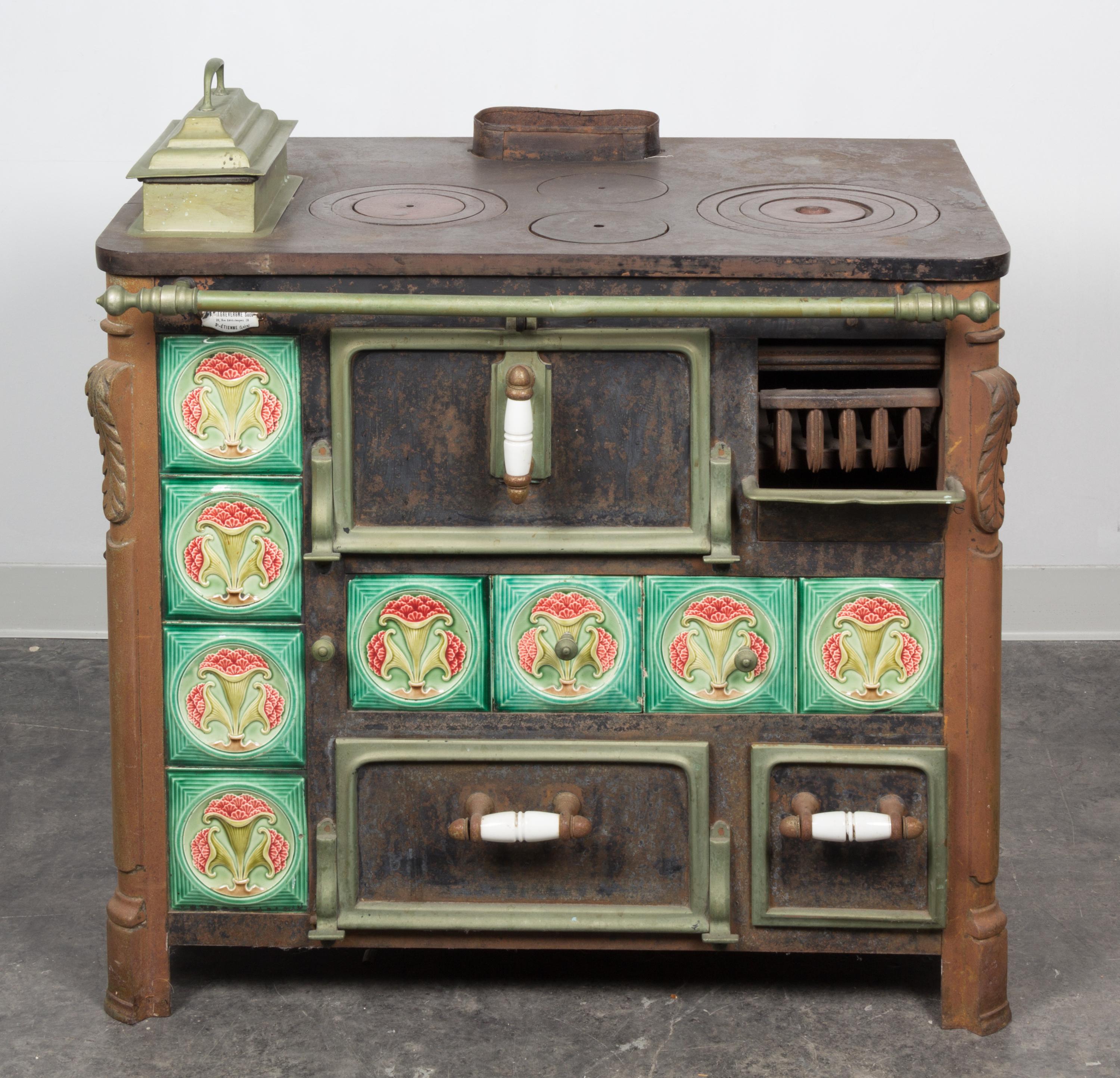 A French Iron Stove Height 31 x width 35 1/2 x depth 24 1/4 inches.