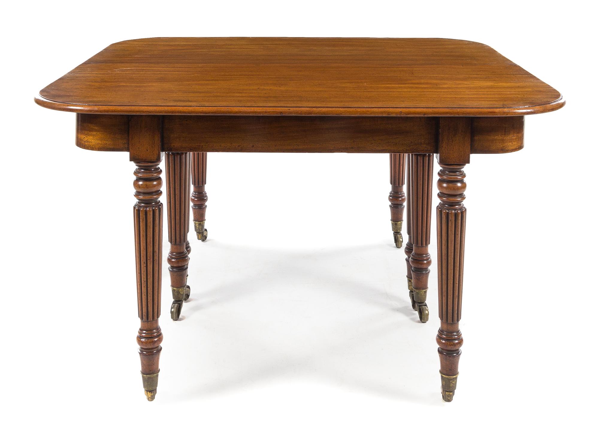 A William IV Mahogany Concertina Action Dining Table Height 29 1/2 x width 51 1/2 x depth 48 inches (closed). — CIRCA 1815