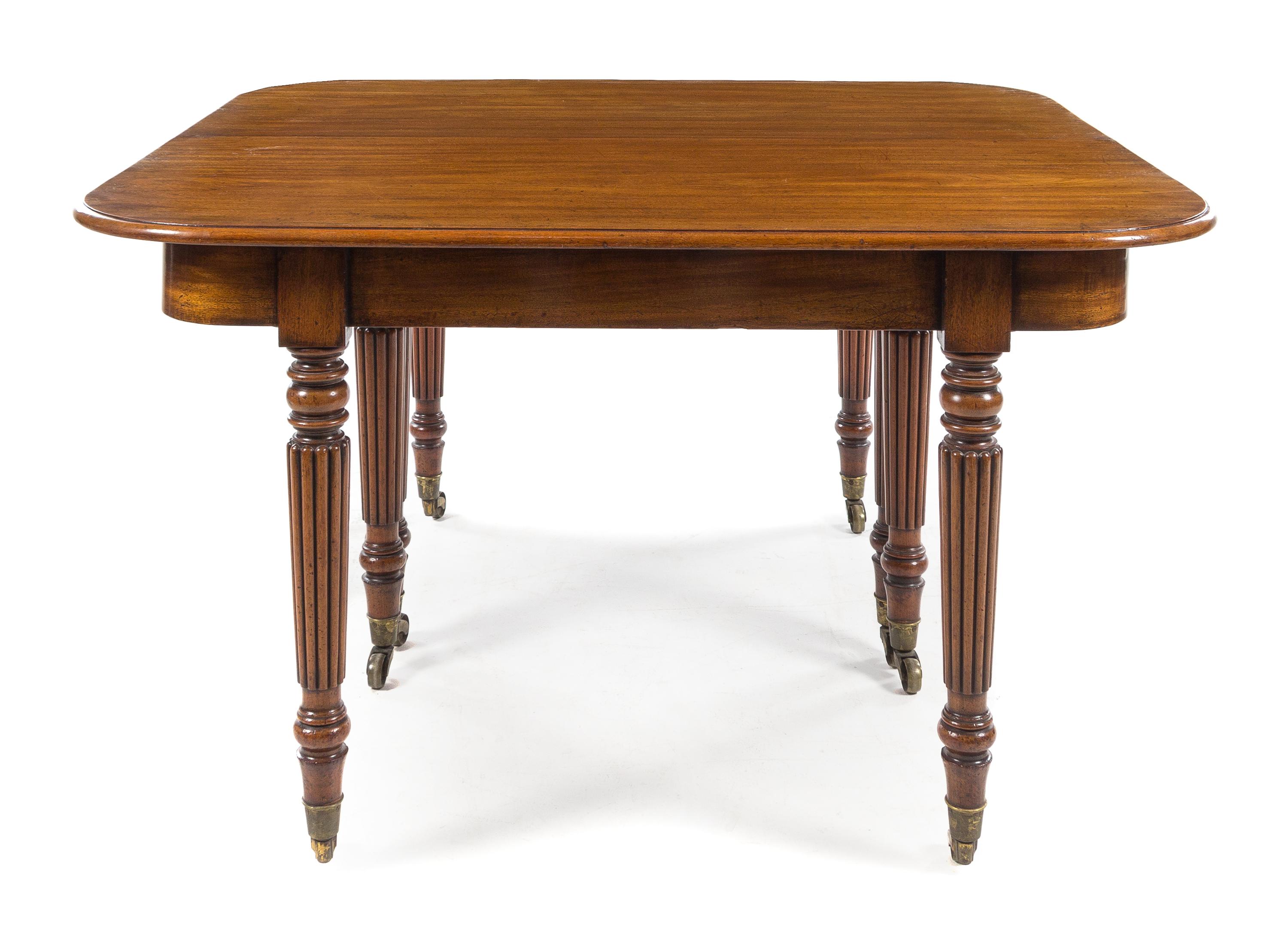 A William IV Mahogany Concertina Action Dining Table Height 29 1/2 x width 51 1/2 x depth 48 inches (closed). — CIRCA 1815