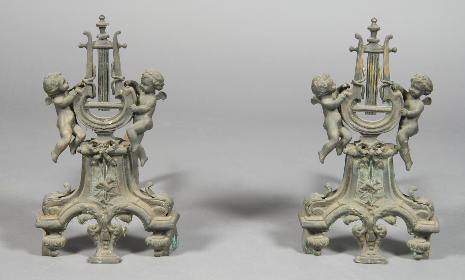 A Pair of Continental Cast Metal Figural Chenets, Height 16 1/4 inches.