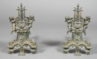 A Pair of Continental Cast Metal Figural Chenets, Height 16 1/4 inches.