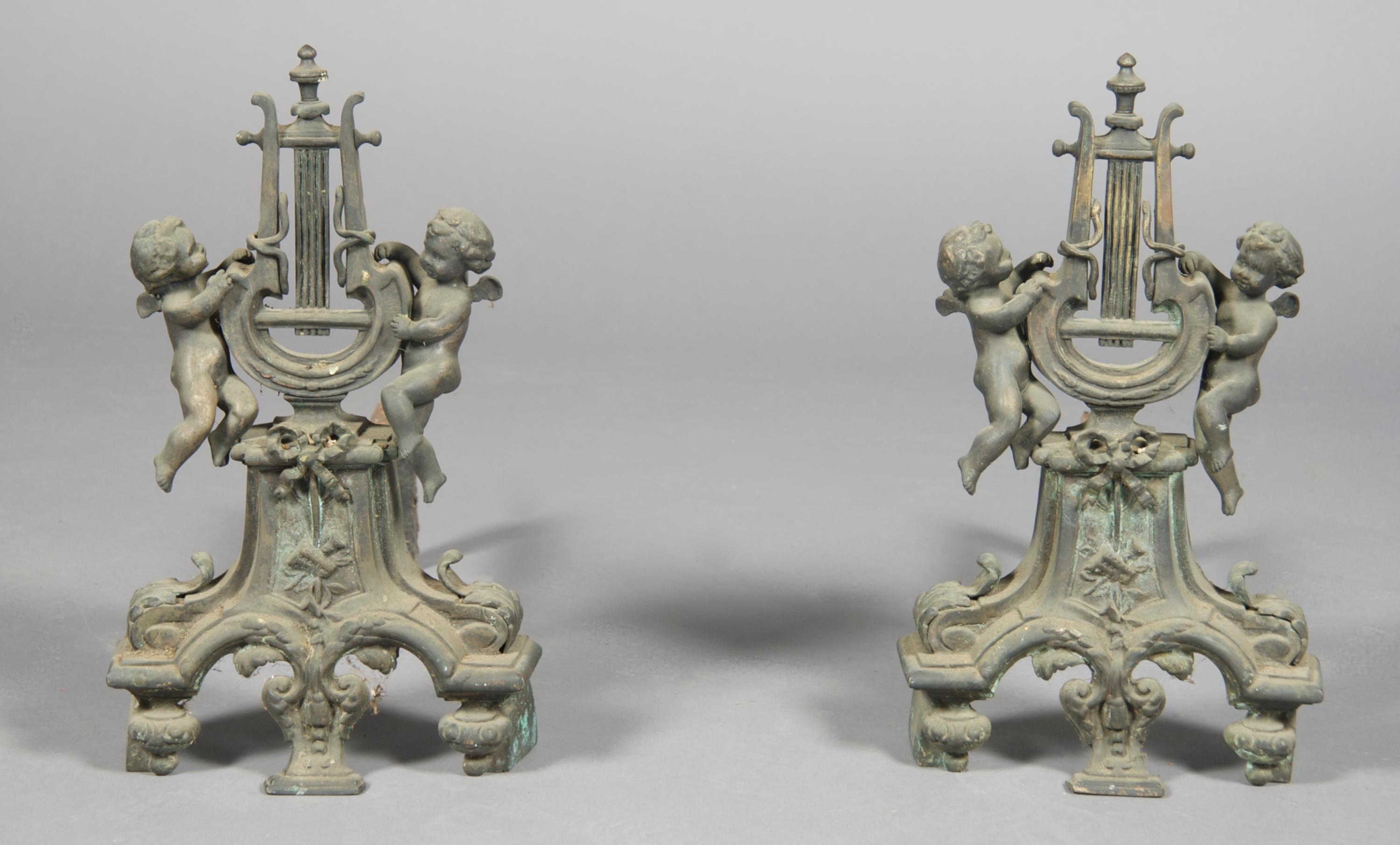 A Pair of Continental Cast Metal Figural Chenets, Height 16 1/4 inches.