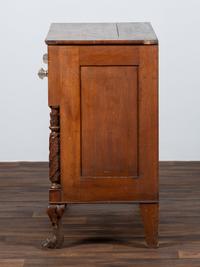 AWAITING DONATION - A Classical Carved Walnut-Veneered Chest of Drawers