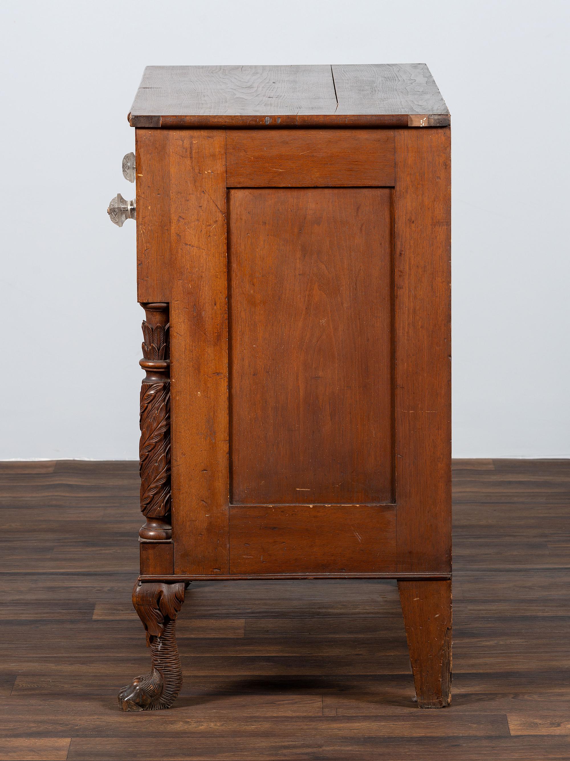 AWAITING DONATION - A Classical Carved Walnut-Veneered Chest of Drawers