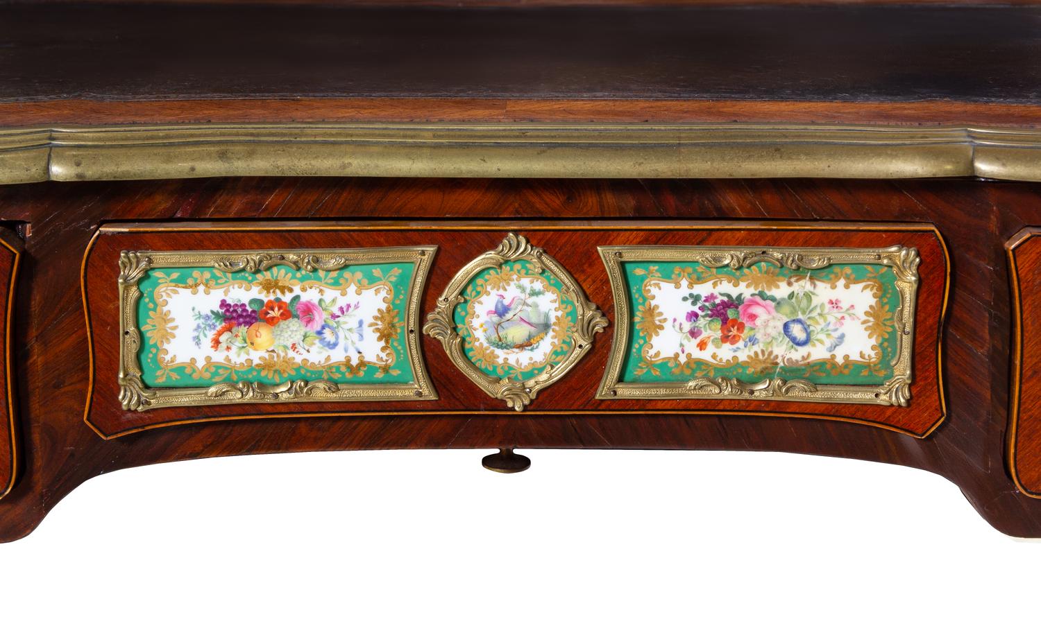 A Louis XV Style Gilt Bronze and Sèvres Style Porcelain Mounted Kingwood Bureau Plat
