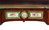 A Louis XV Style Gilt Bronze and Sèvres Style Porcelain Mounted Kingwood Bureau Plat