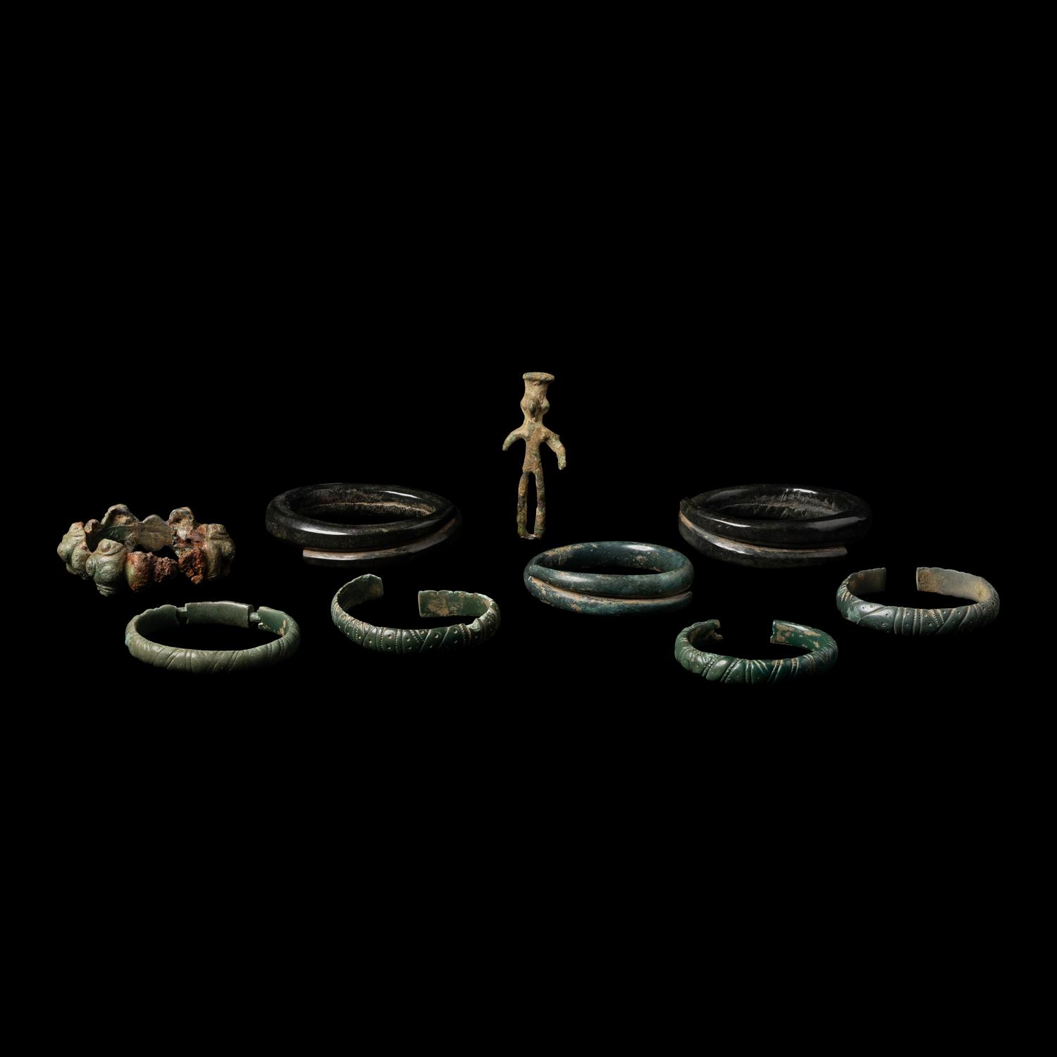 Eight European Bronze Armlets, Bracelets and a Figure