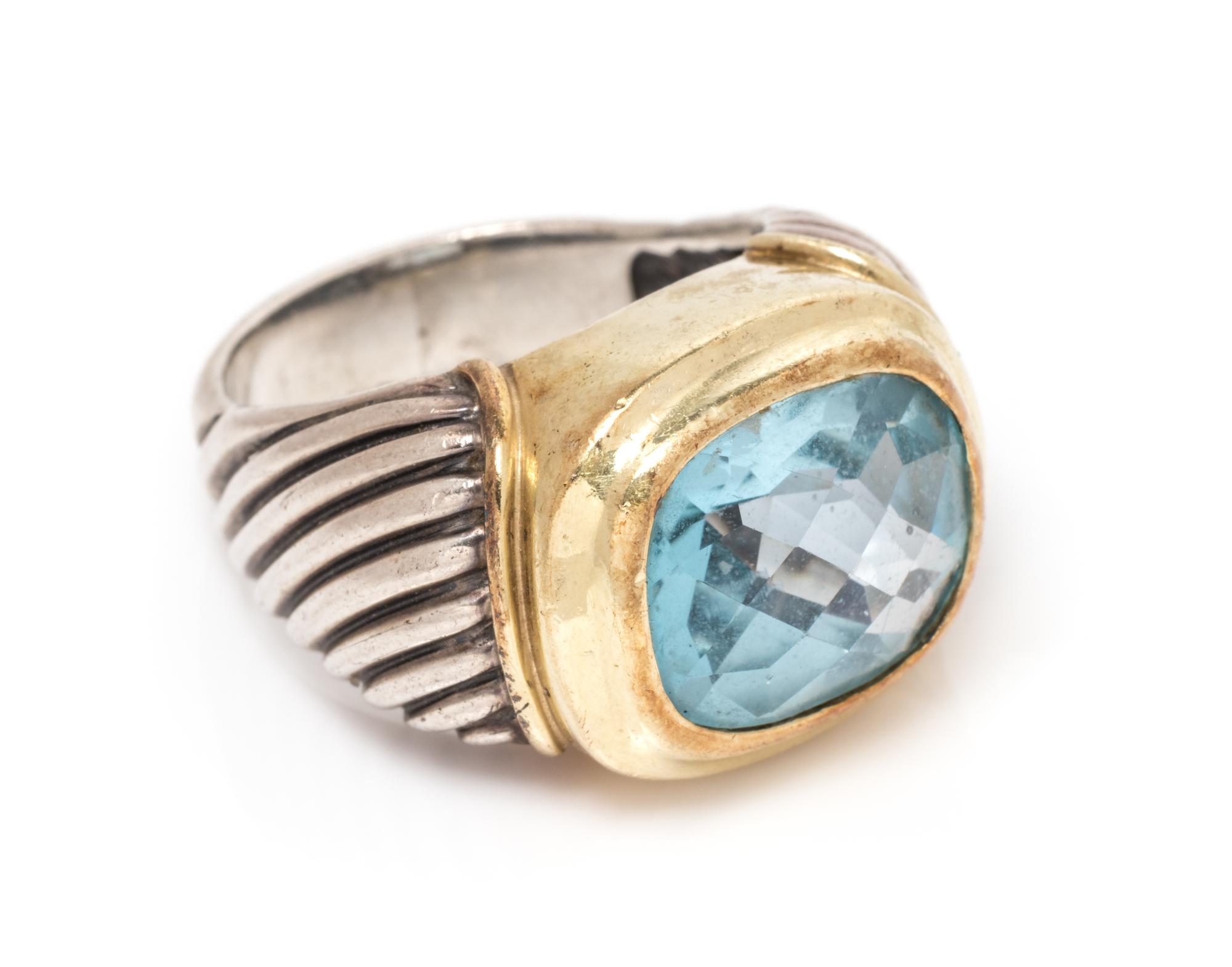 A Sterling Silver, 14 Karat Yellow Gold and Blue Topaz Ring, David Yurman, 8.85 dwts.