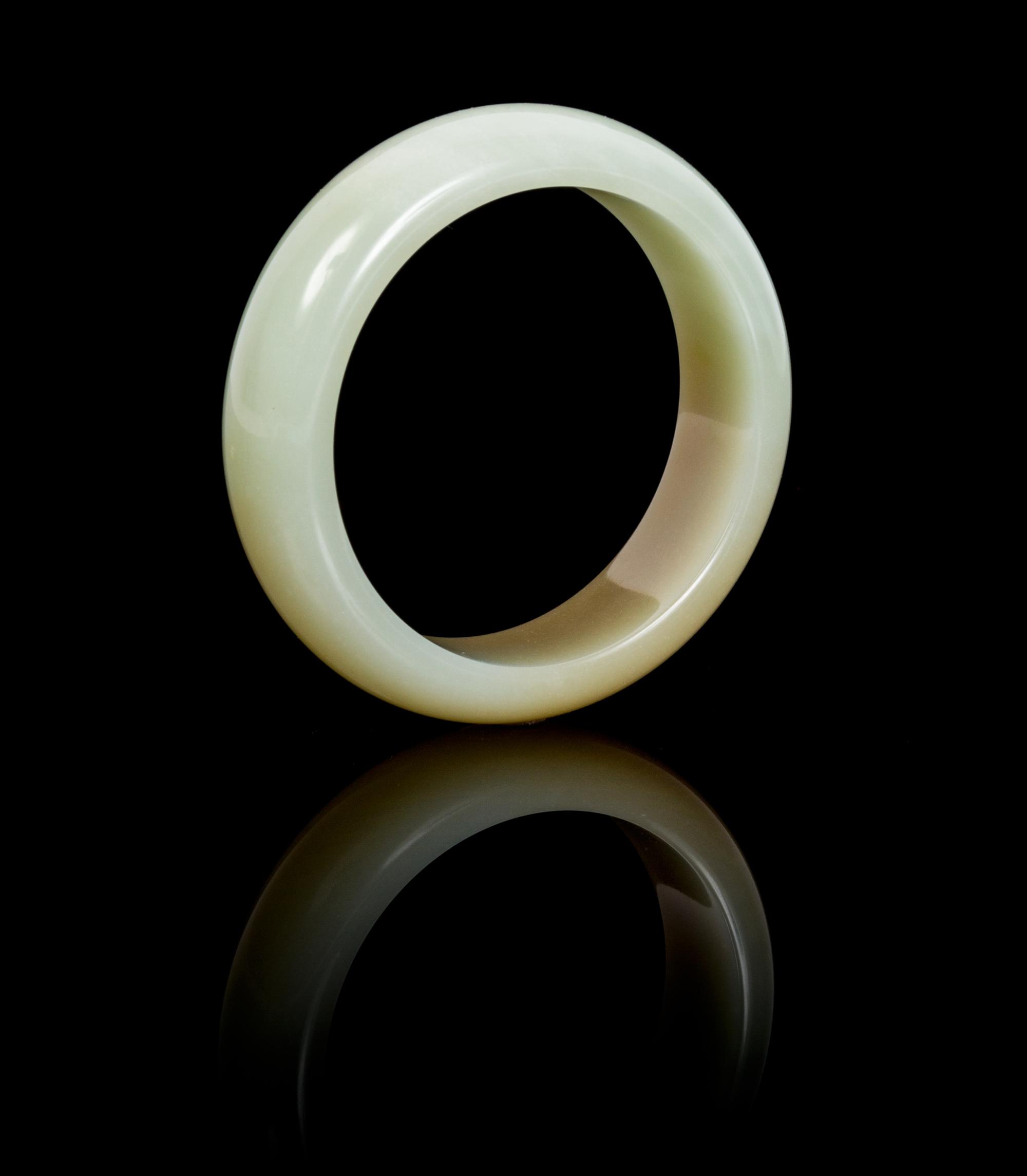 A Jade Bangle Diameter of interior 2 1/4 inches.