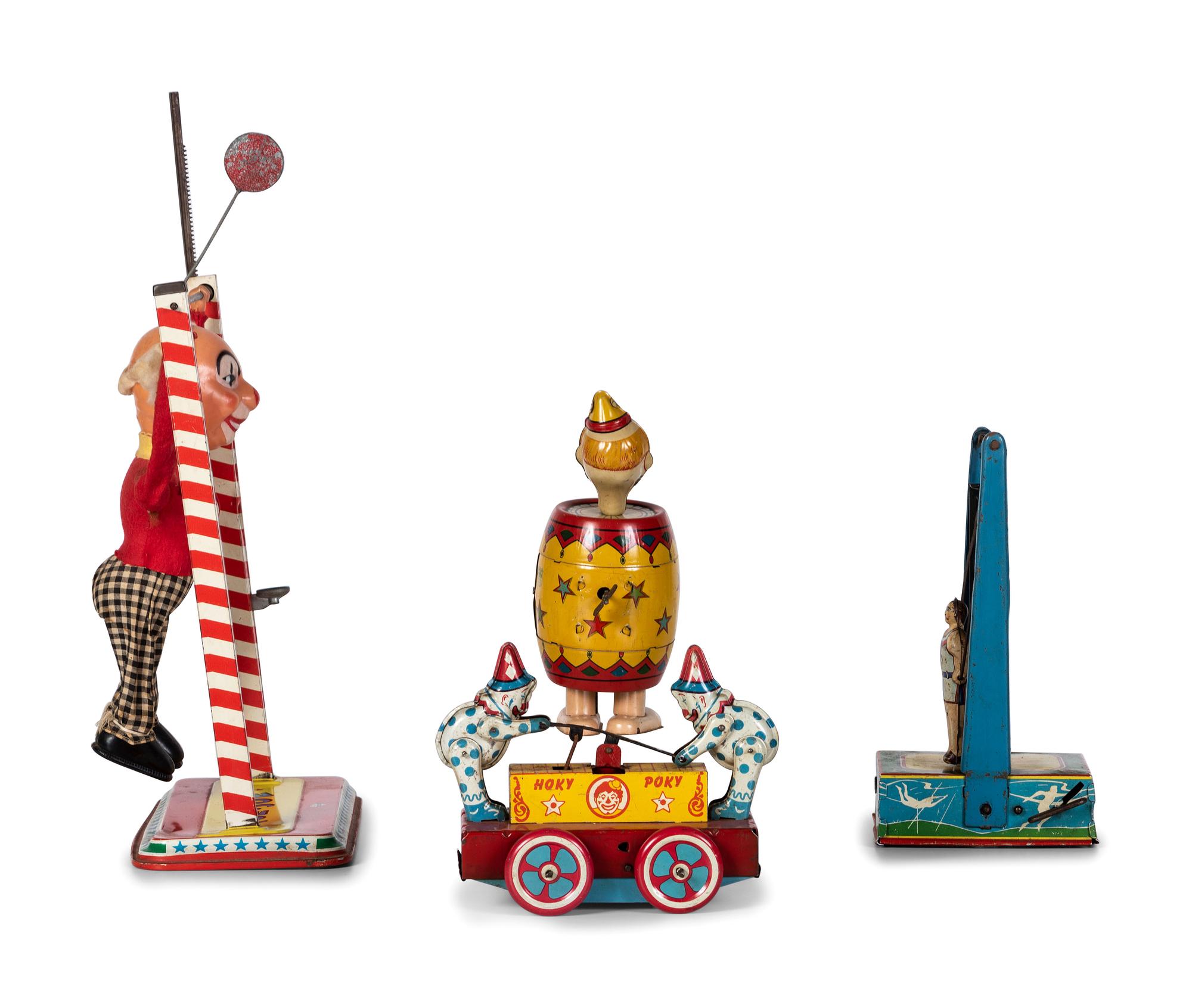 Four Tin Circus and Clown Toys