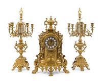 A Regence Style Gilt-Metal Three-Piece Clock Garniture