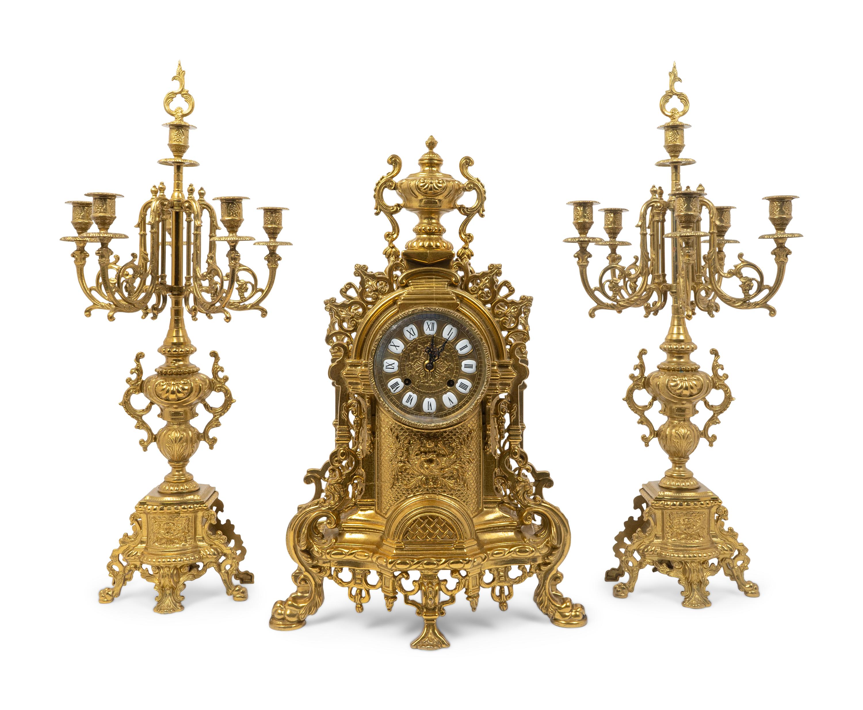 A Regence Style Gilt-Metal Three-Piece Clock Garniture
