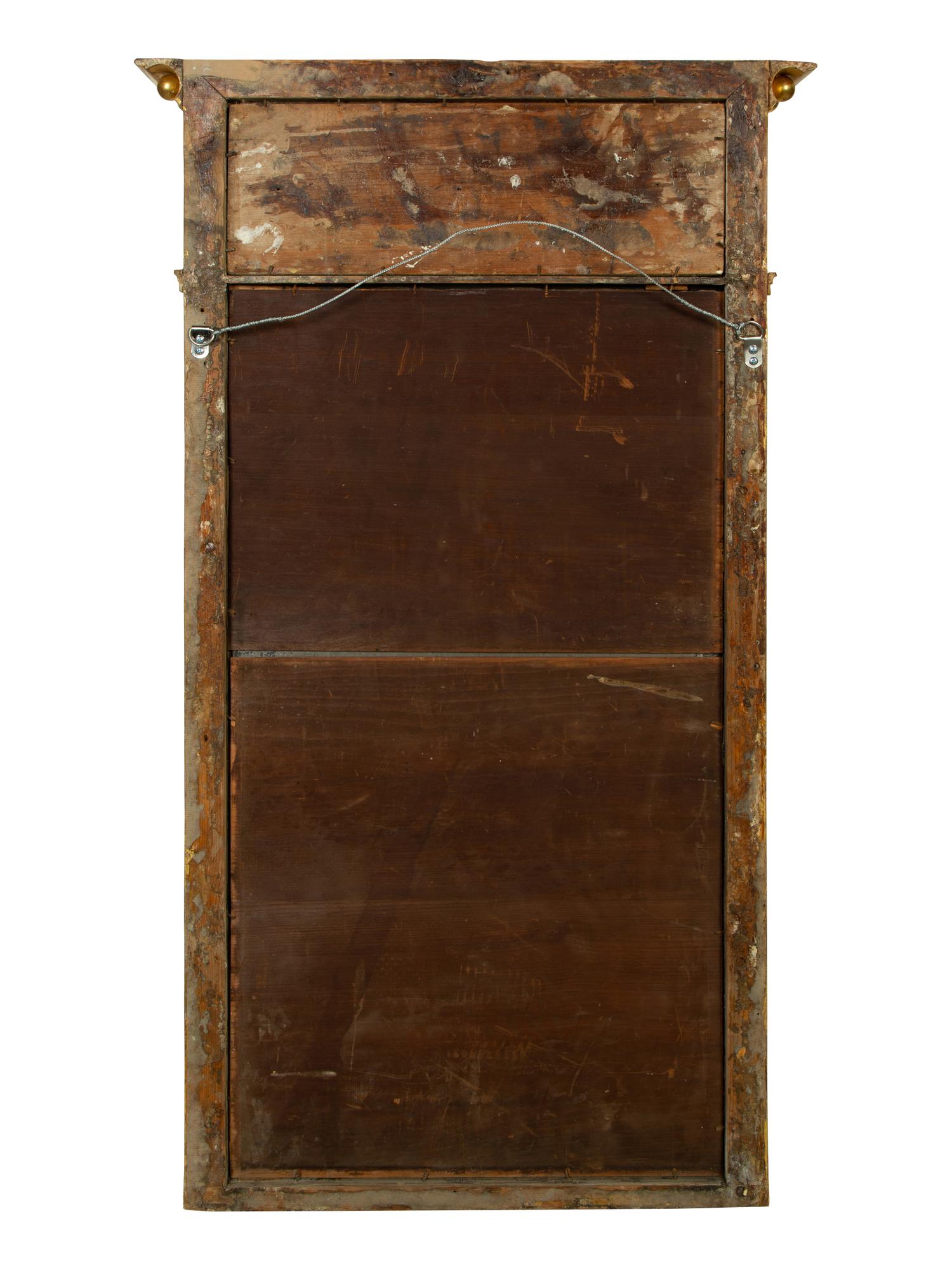 A French Egyptian Revival Giltwood Mirror