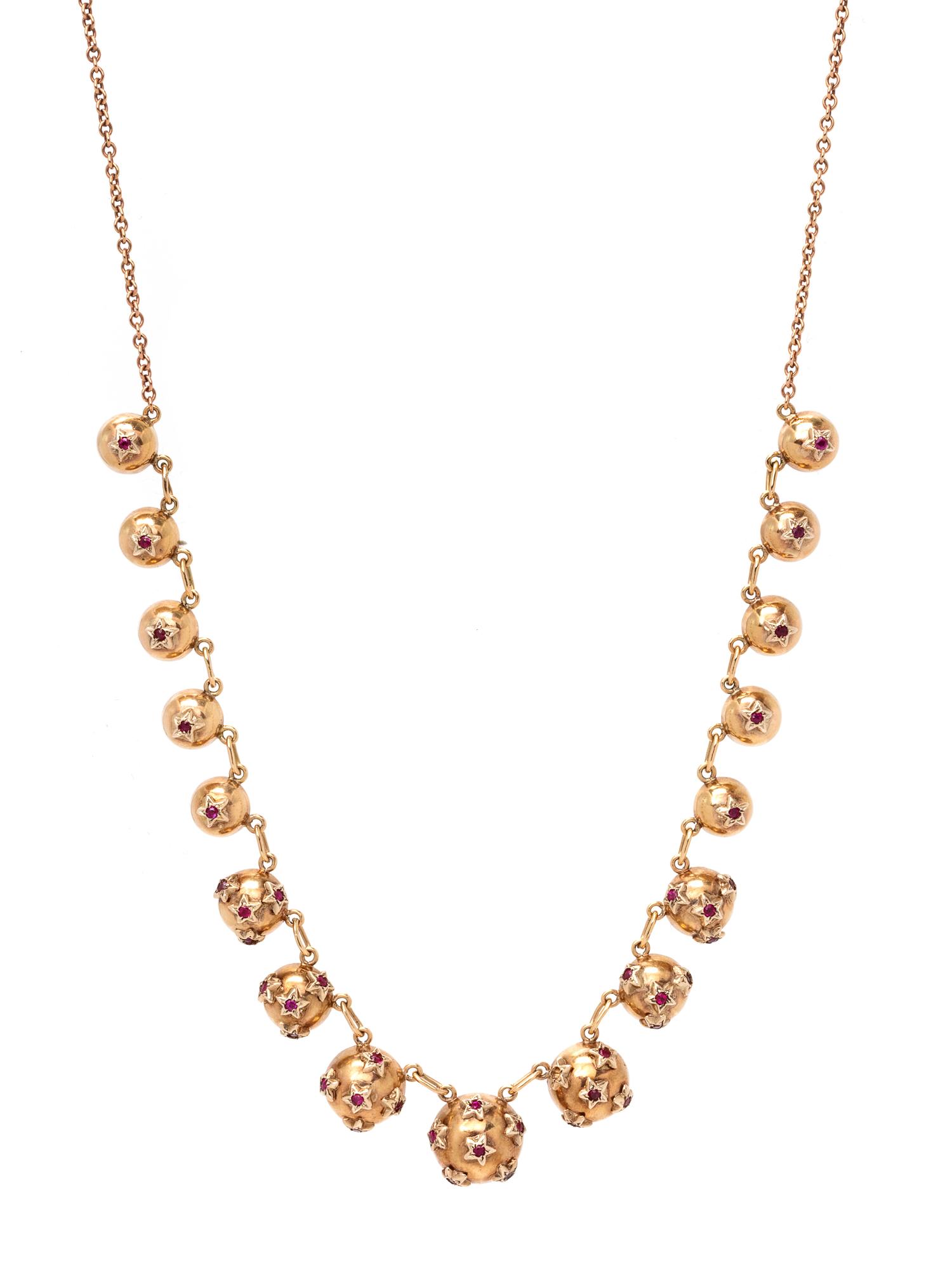 A Nine Karat Rose Gold and Ruby Necklace, British,