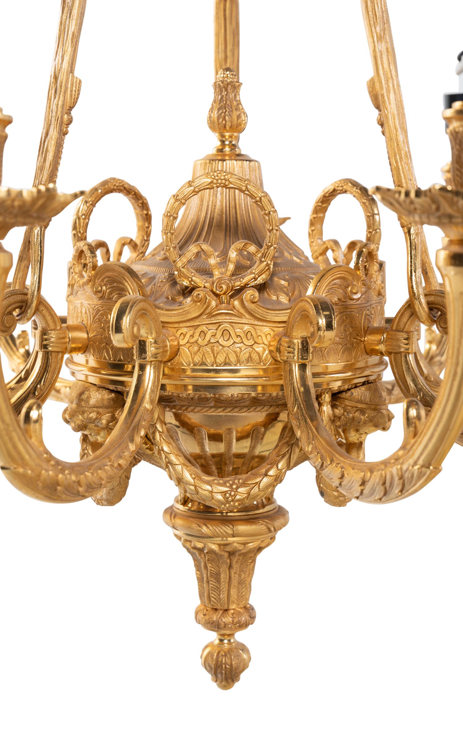 A Pair of Empire Style Gilt Bronze Nine-Light Chandeliers