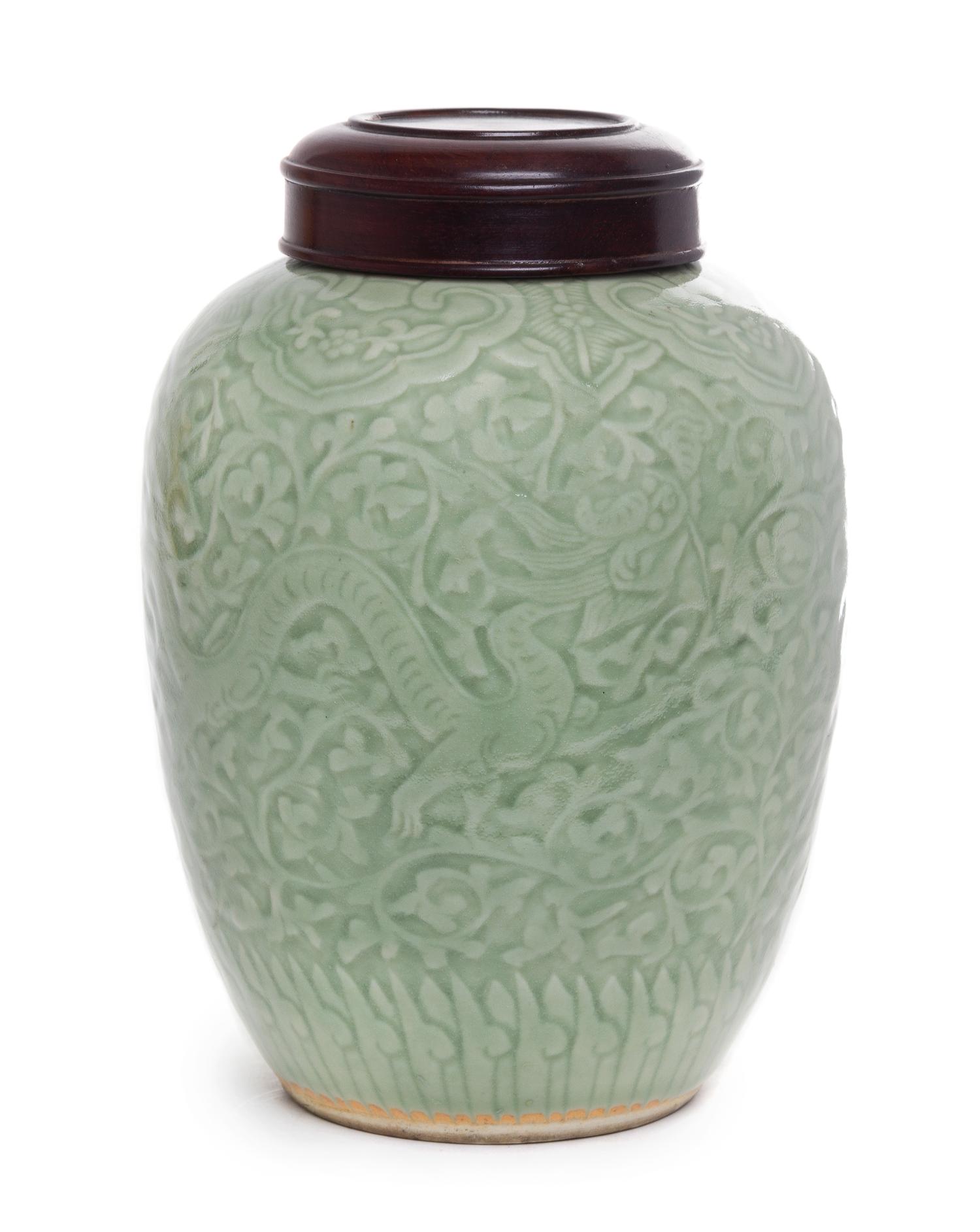 A Celadon Glazed Porcelain Jar Height 9 1/2 inches.