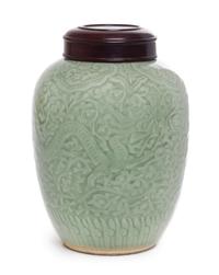 A Celadon Glazed Porcelain Jar Height 9 1/2 inches.