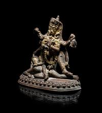 A Nepalese Parcel Gilt Bronze Figure of Kali