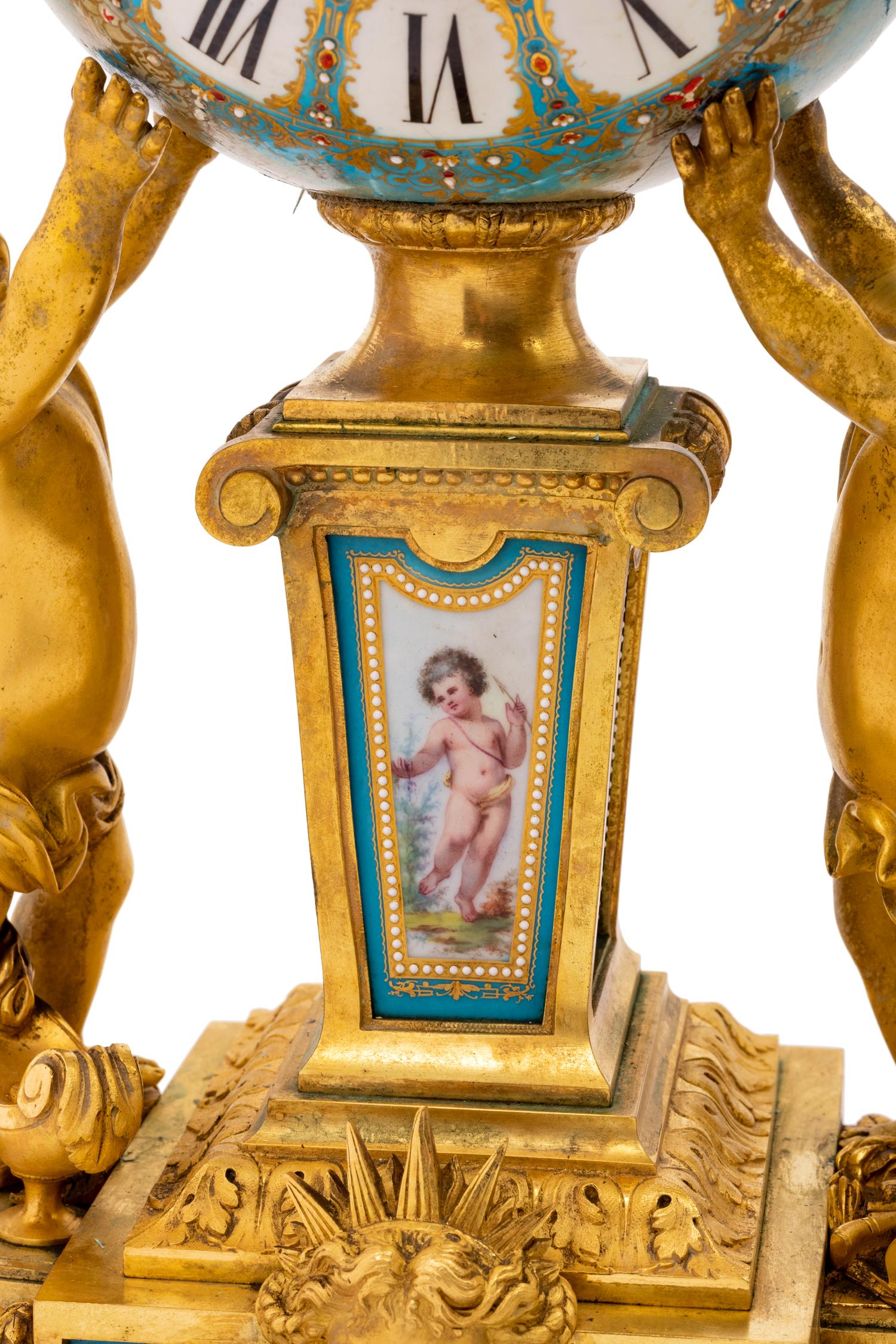 A Sèvres Style Porcelain and Gilt Bronze Mounted Three-Piece Clock Garniture