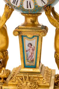 A Sèvres Style Porcelain and Gilt Bronze Mounted Three-Piece Clock Garniture