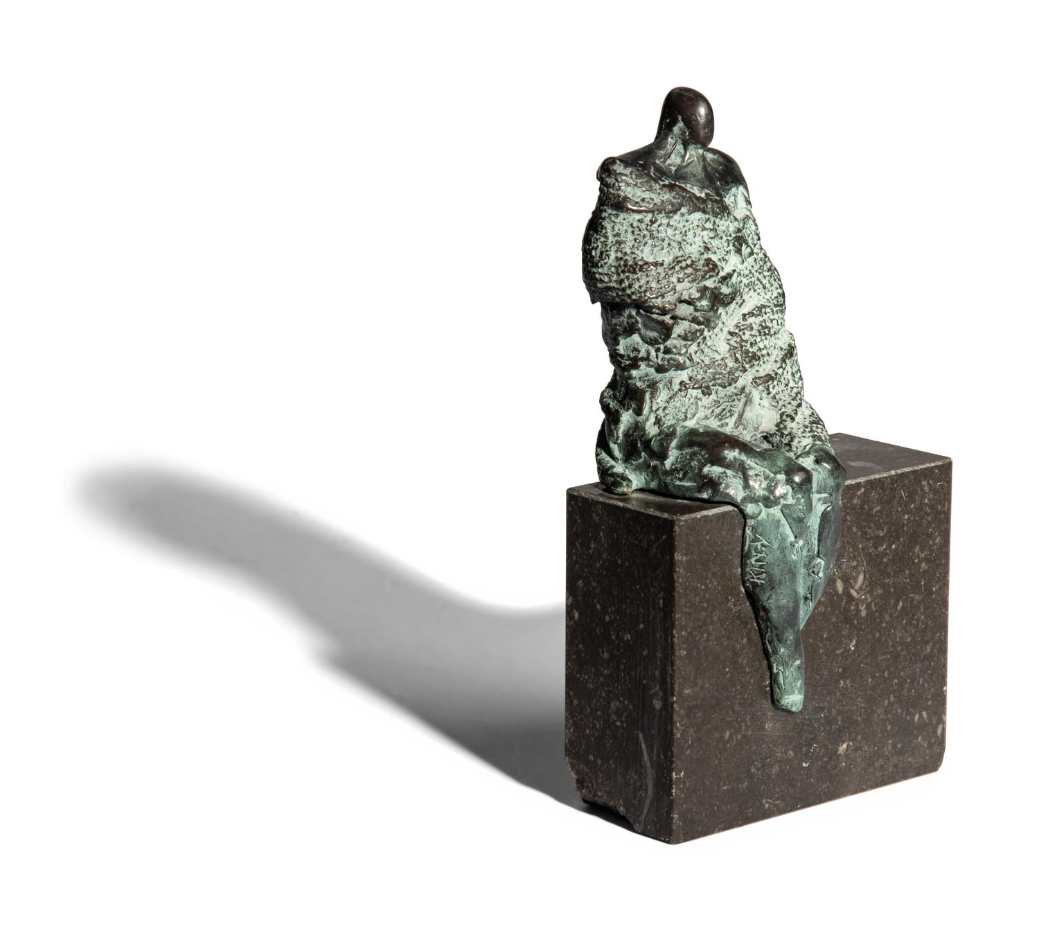 Sculpture, seated man
