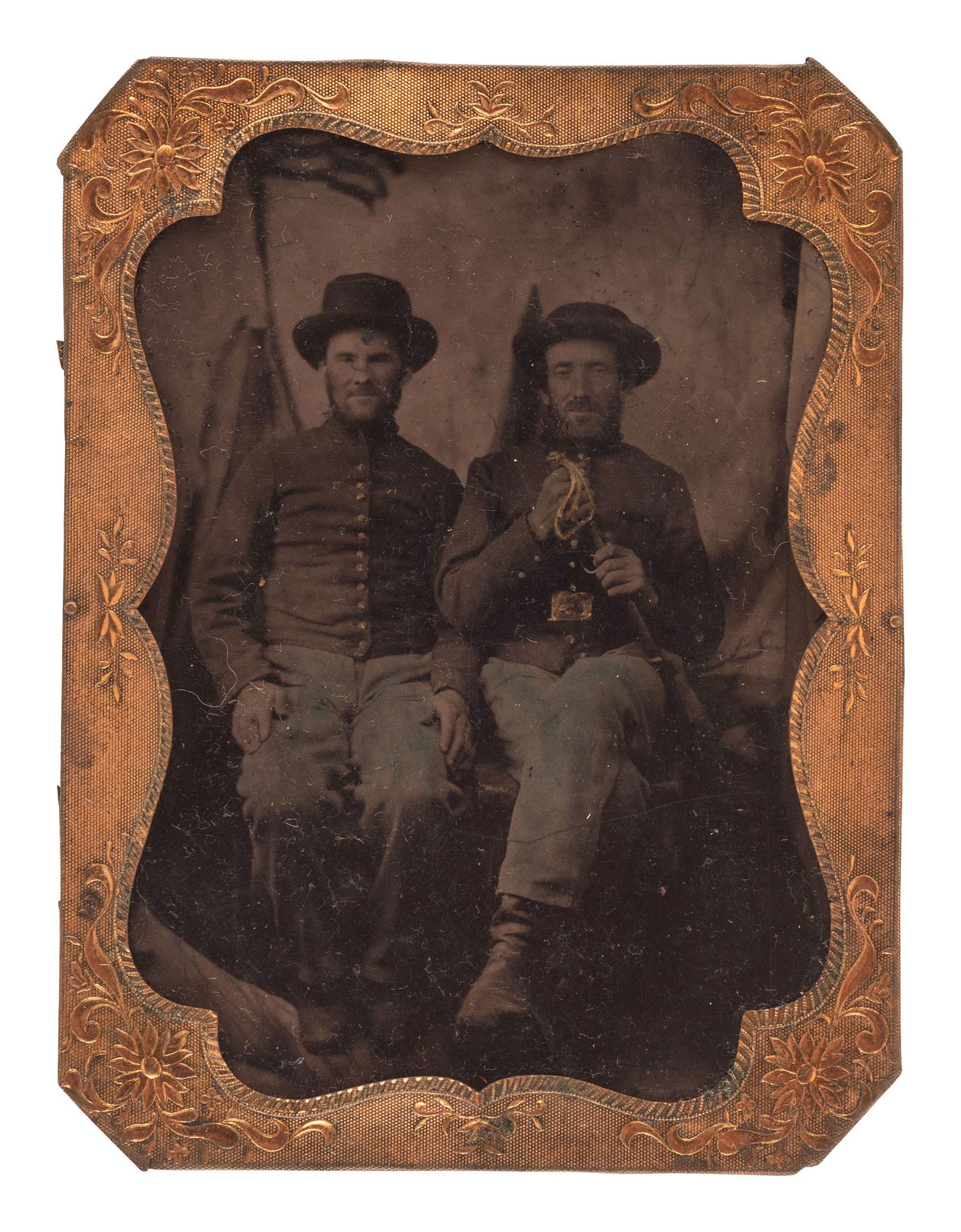 [CIVIL WAR]. Two photographs of Federal soldiers, incl. quarter plate ruby ambrotype of a double-armed soldier and tintype of Union pards.