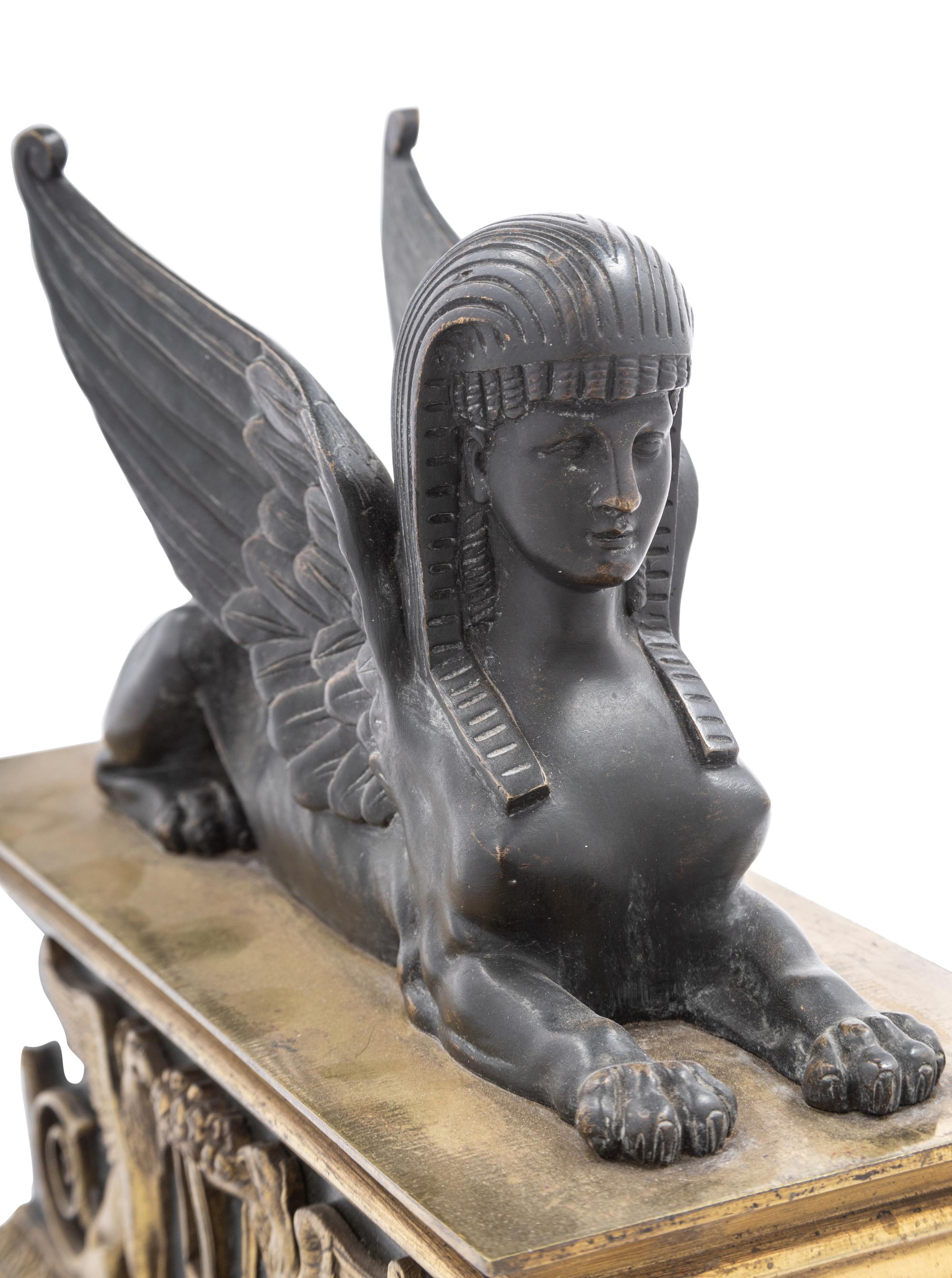 A Pair of Empire Gilt and Patinated Bronze Sphinx Ornaments