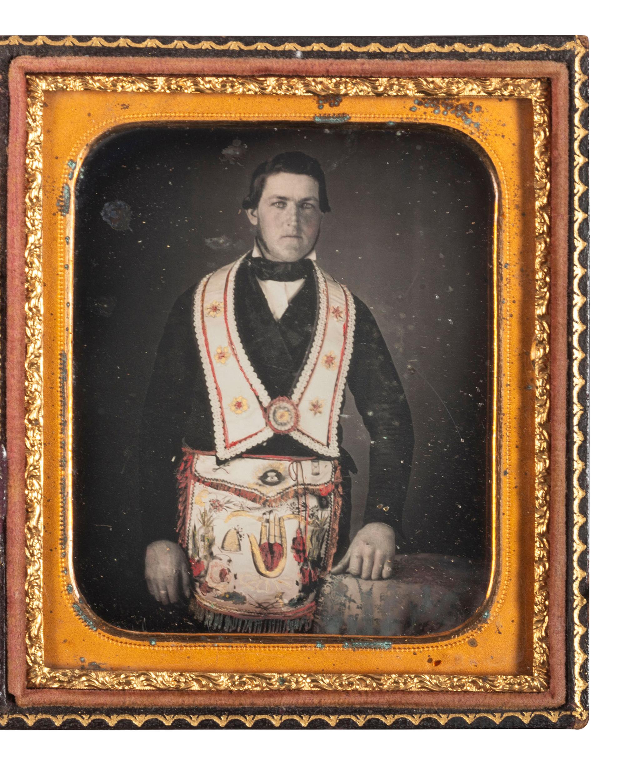 [EARLY PHOTOGRAPHY]. Sixth plate daguerreotype of an Odd Fellow in regalia featuring fine hand tinting.