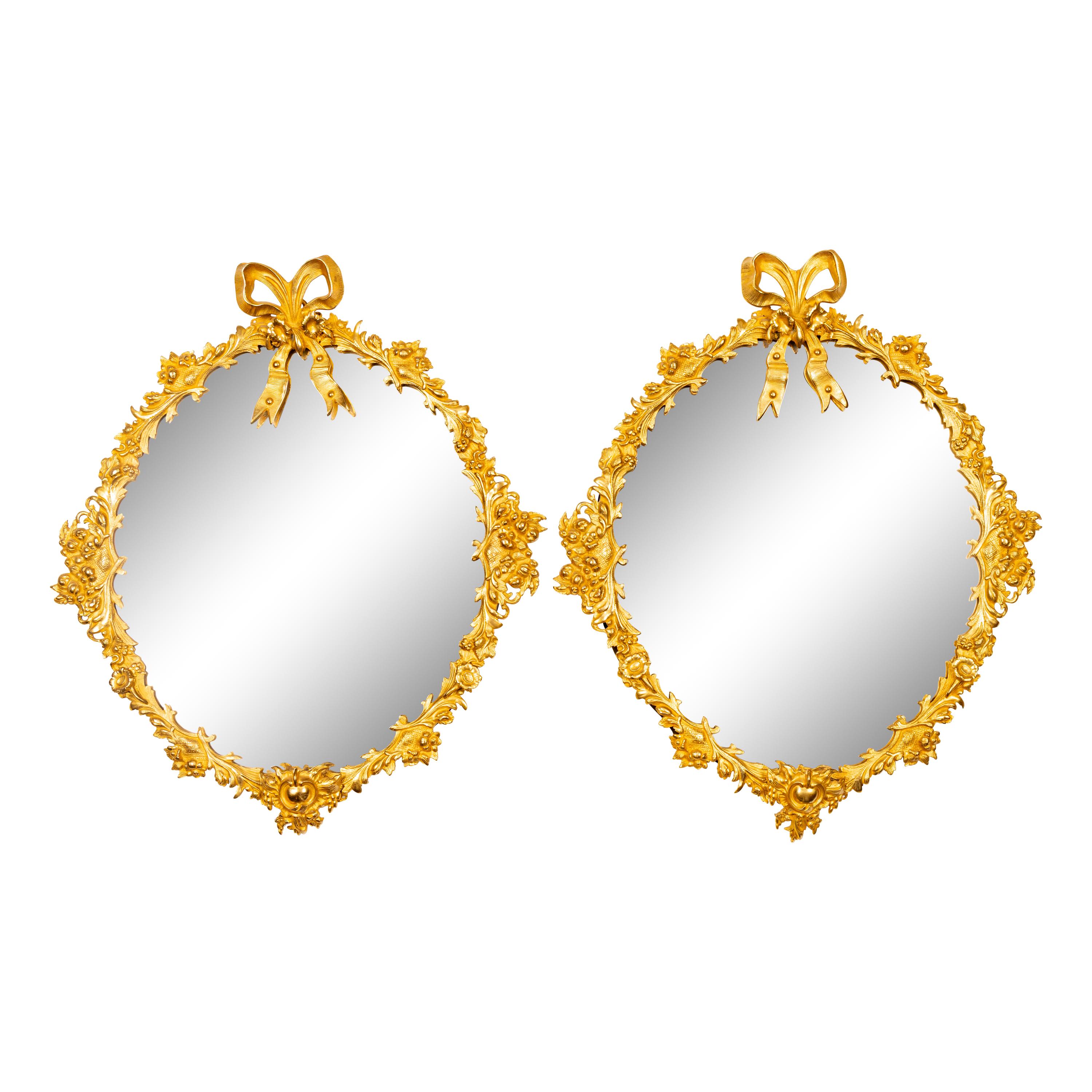 A Pair of Continental Bronze Mirrors