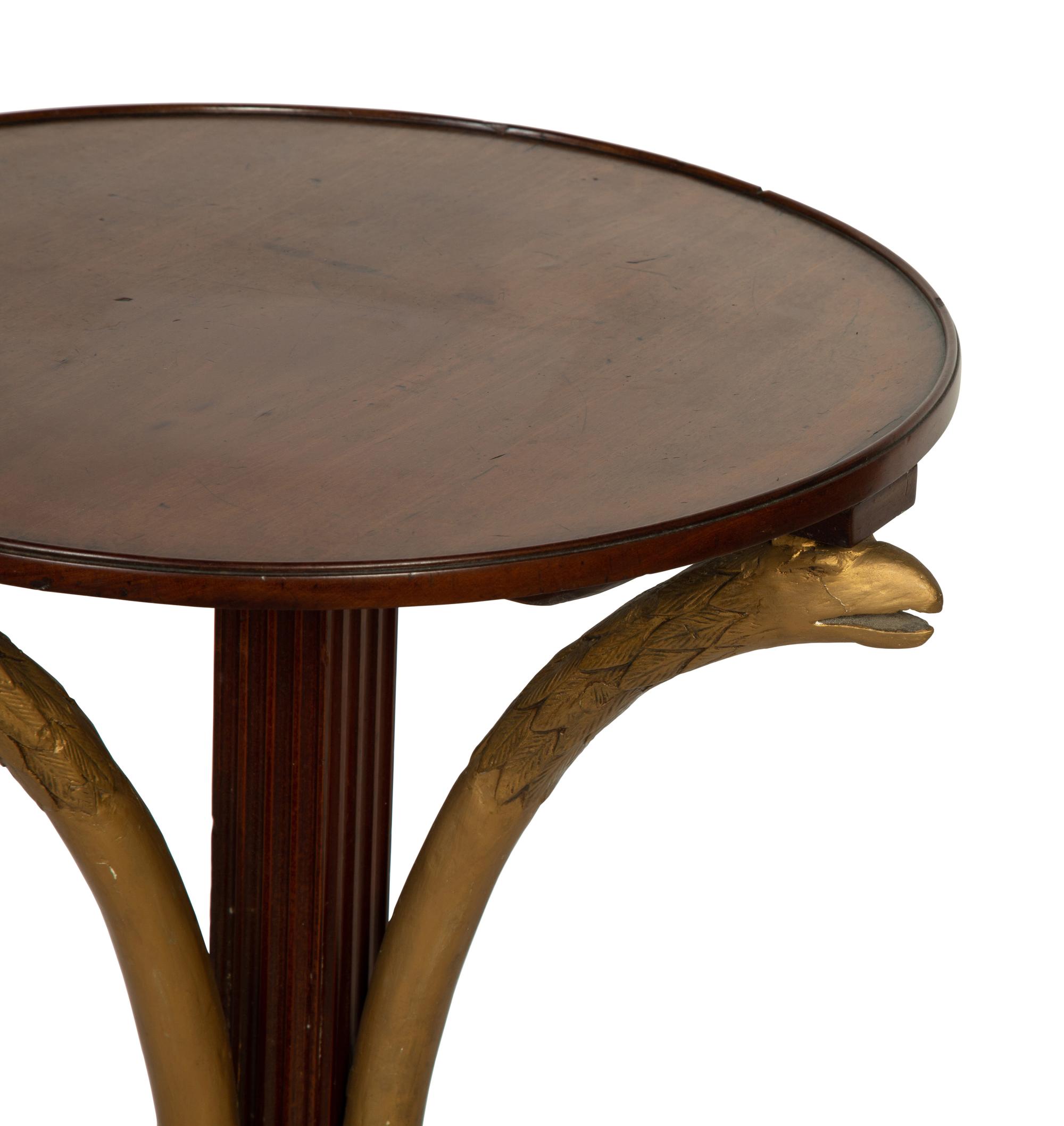 An Empire Style Parcel Gilt Mahogany Side Table