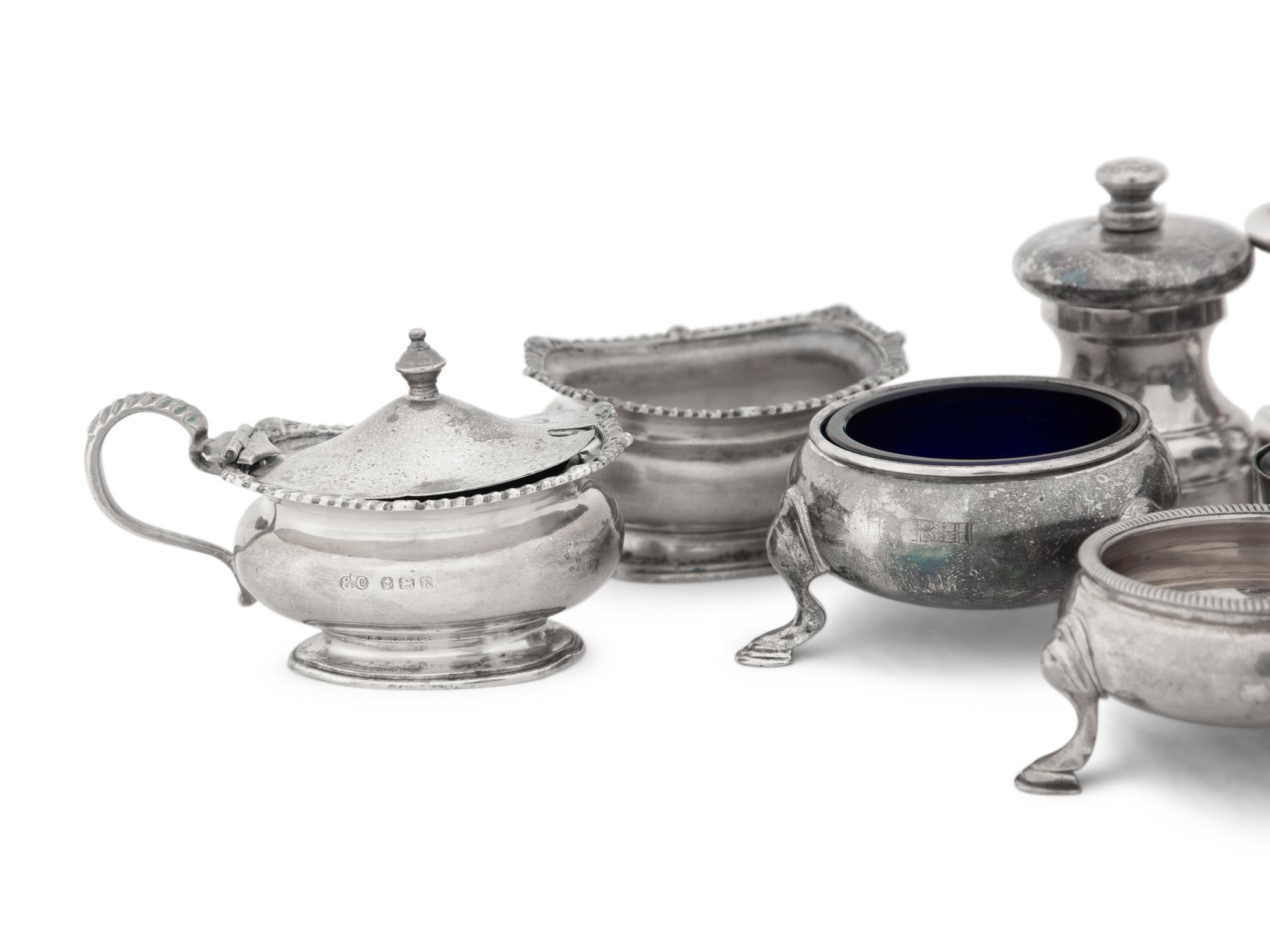 A Collection of Silver Pepper Mills and Salt Cellars