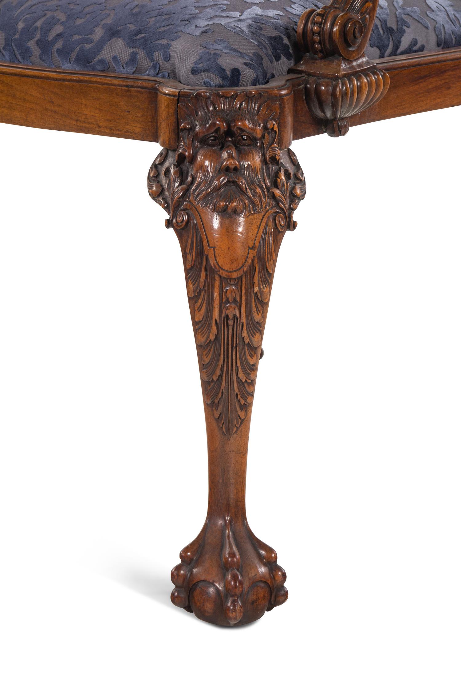 An Irish George I Style Carved Walnut Armchair