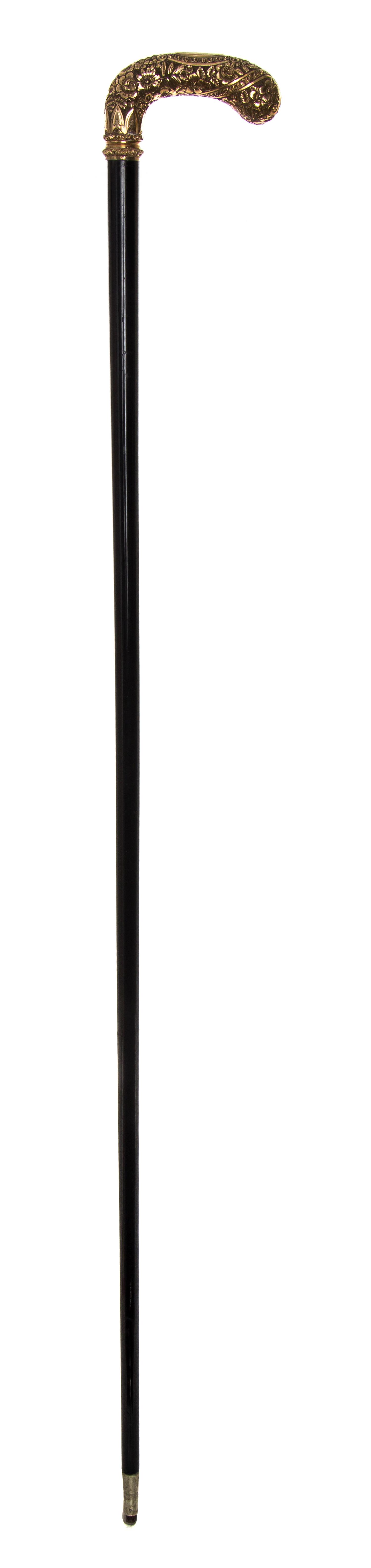 An American Presentation 14 Karat Gold Handled Cane, Length of handle 5 x length overall 34 inches.