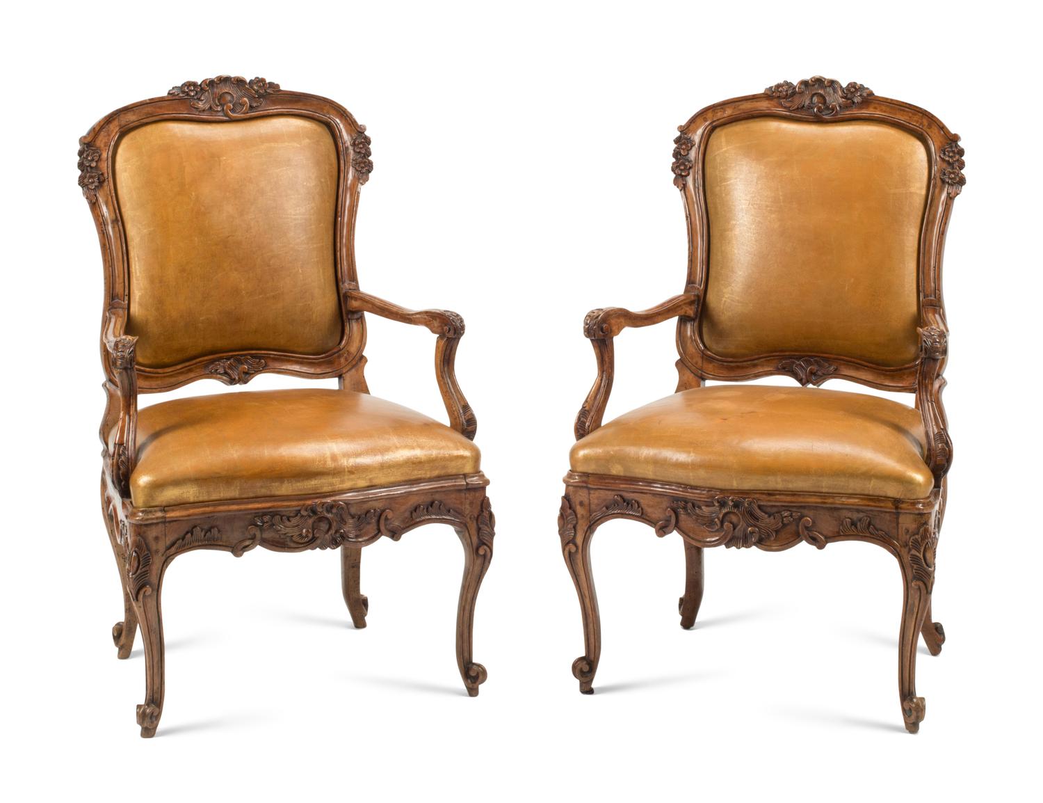 A Pair of French Provincial Carved Walnut Armchairs