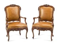 A Pair of French Provincial Carved Walnut Armchairs