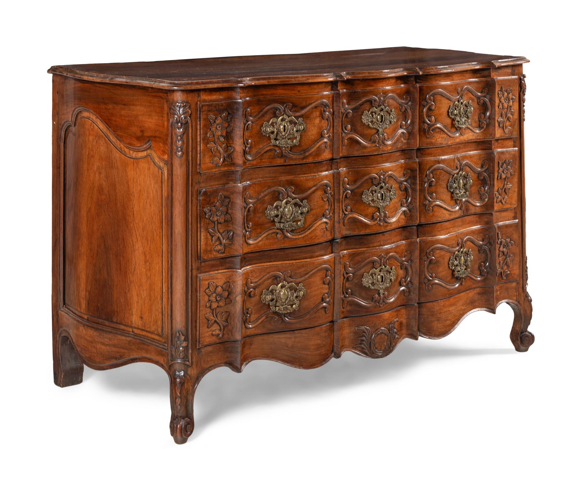 A Louis XV Walnut Serpentine Front Commode