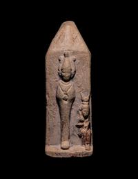 An Egyptian Limestone Case in the Form of an Obelisk with Osiris and Isis