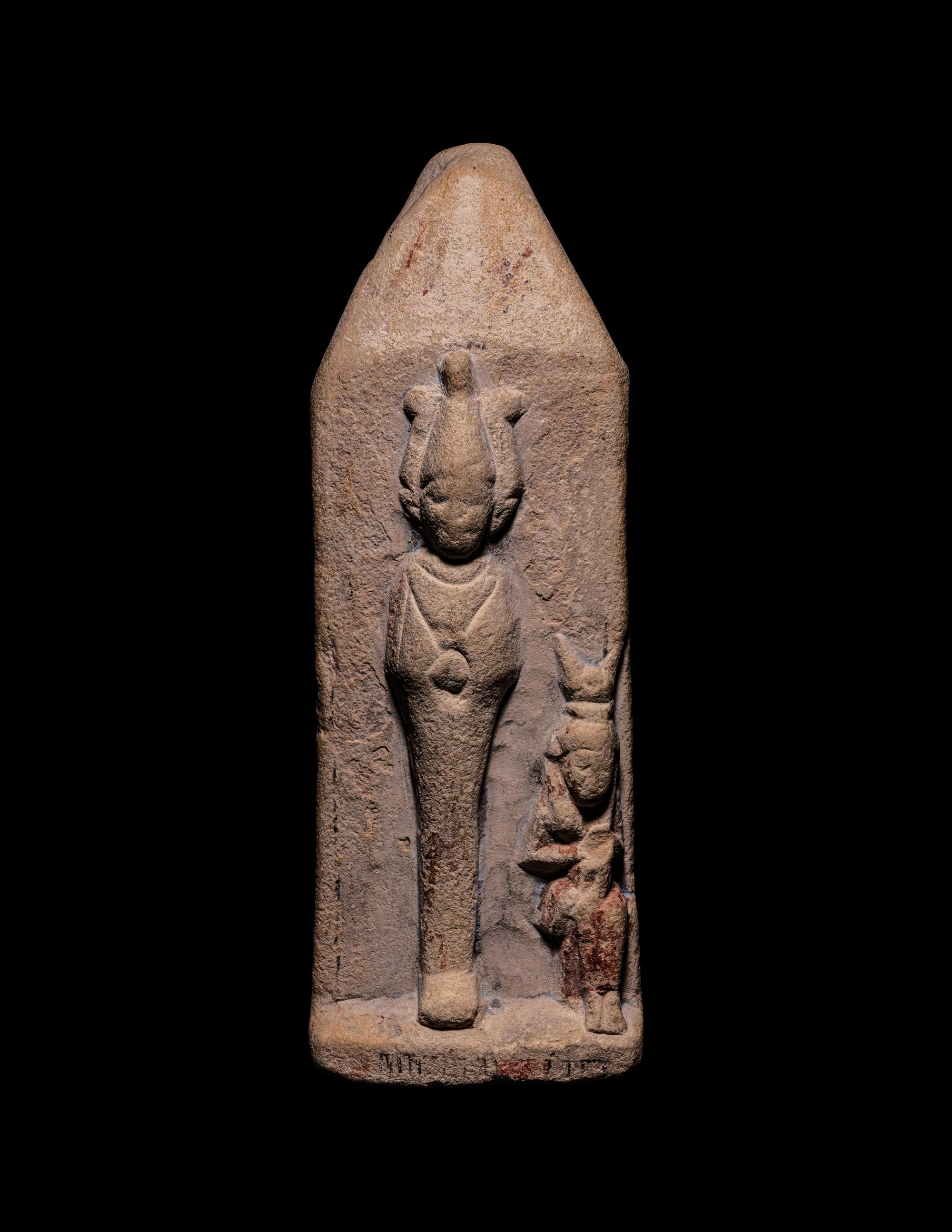 An Egyptian Limestone Case in the Form of an Obelisk with Osiris and Isis