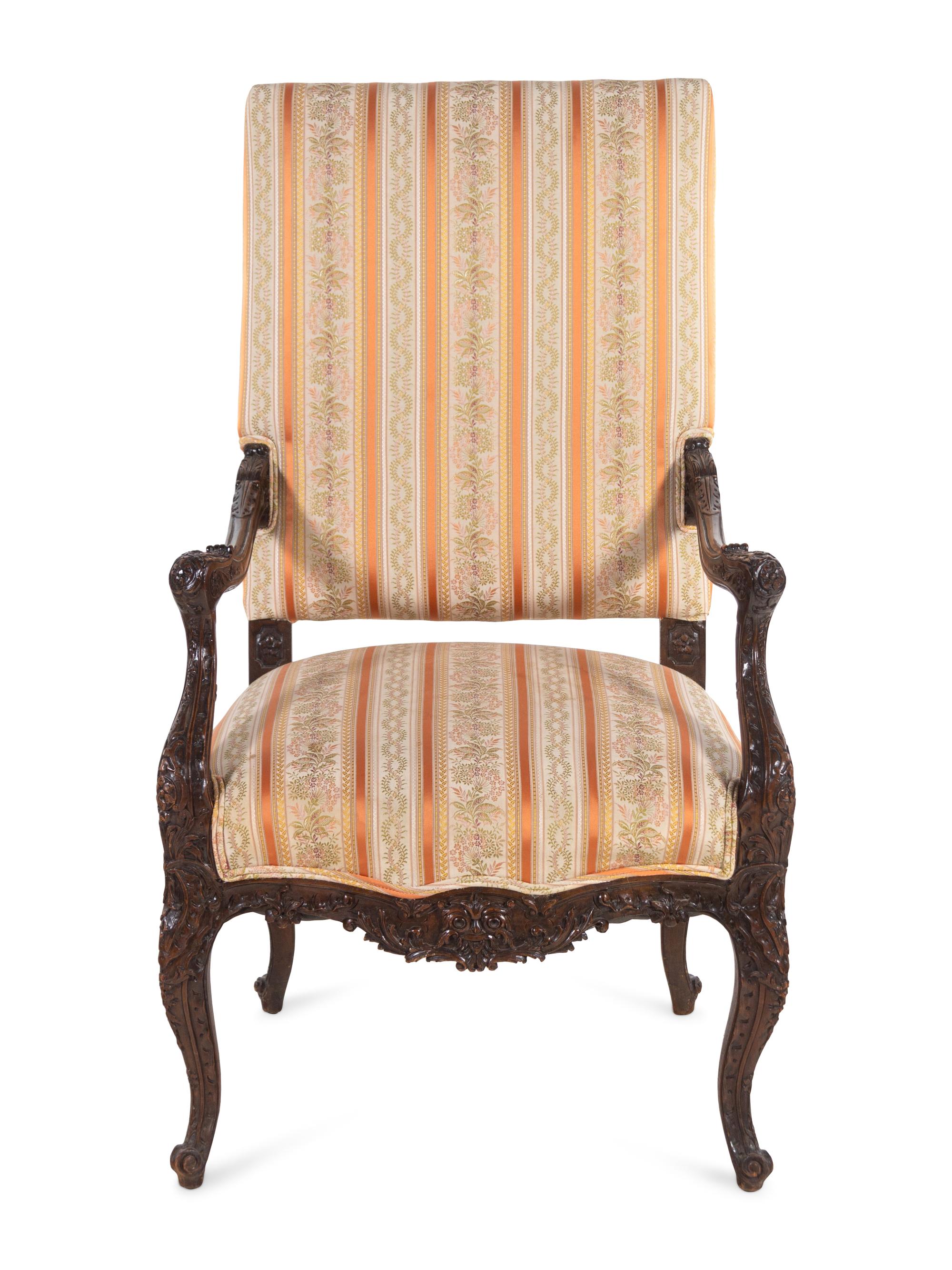 A Régence Style Carved Walnut Fauteuil
