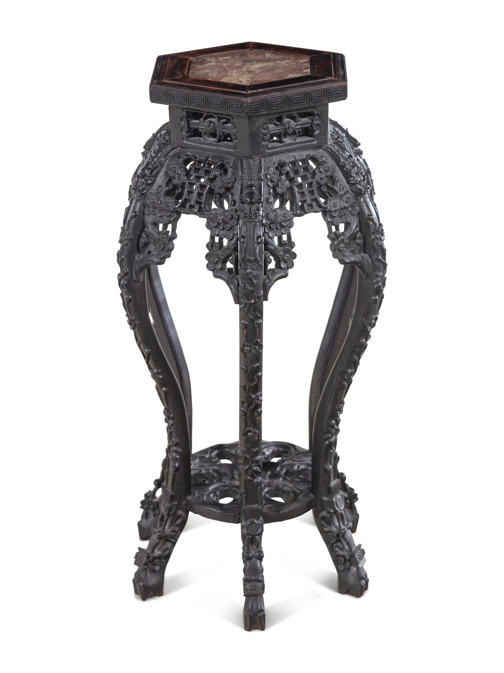 A Chinese Carved Hardwood and Marble-Inset Pedestal Table