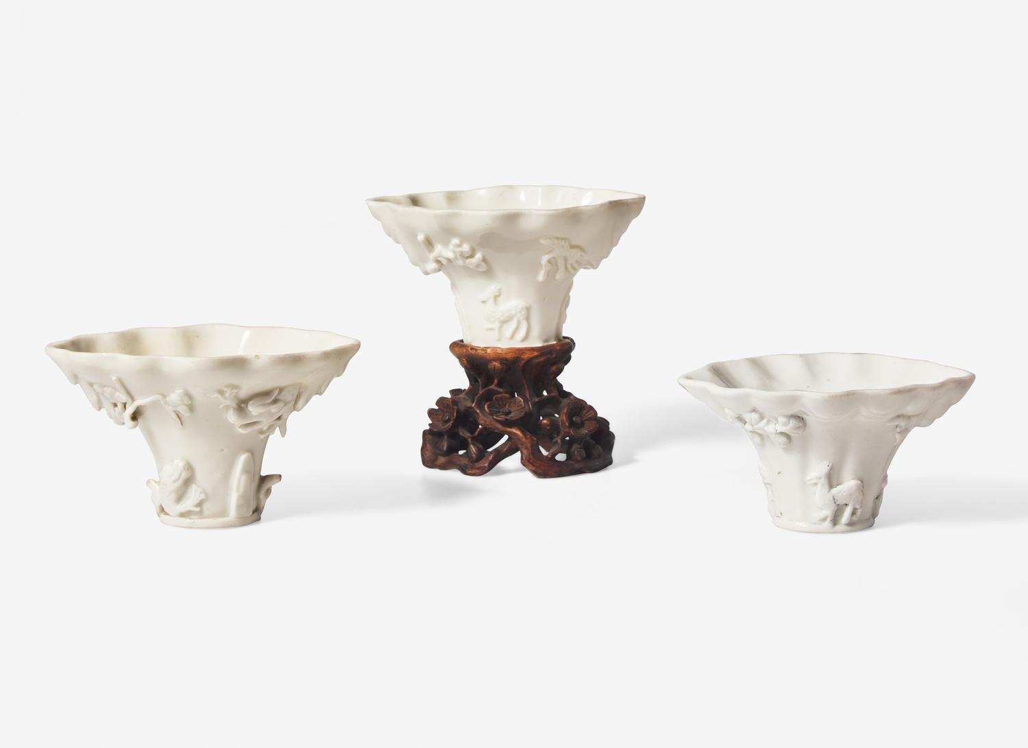 Three Chinese Dehua Porcelain Libation Cups and a Wood Stand